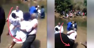 Lady Drags Pastor Into The River During Church Baptism (Video)