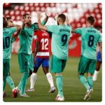 Karim Benzema celebrating goal with teammates in Granada vs Real Madrid game