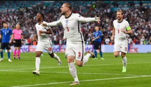 Luke Shaw celebrating opening goal along with Kane & Sterling against Italy