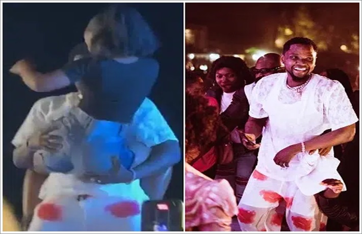 Moment Lady Jumps On Kizz Daniel, Twerks On Him During Stage Performance (Video)