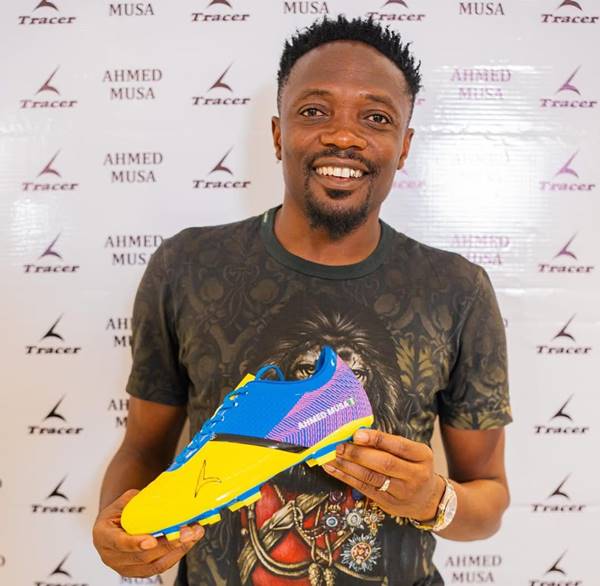 Ahmed Musa holding Tracer Boot